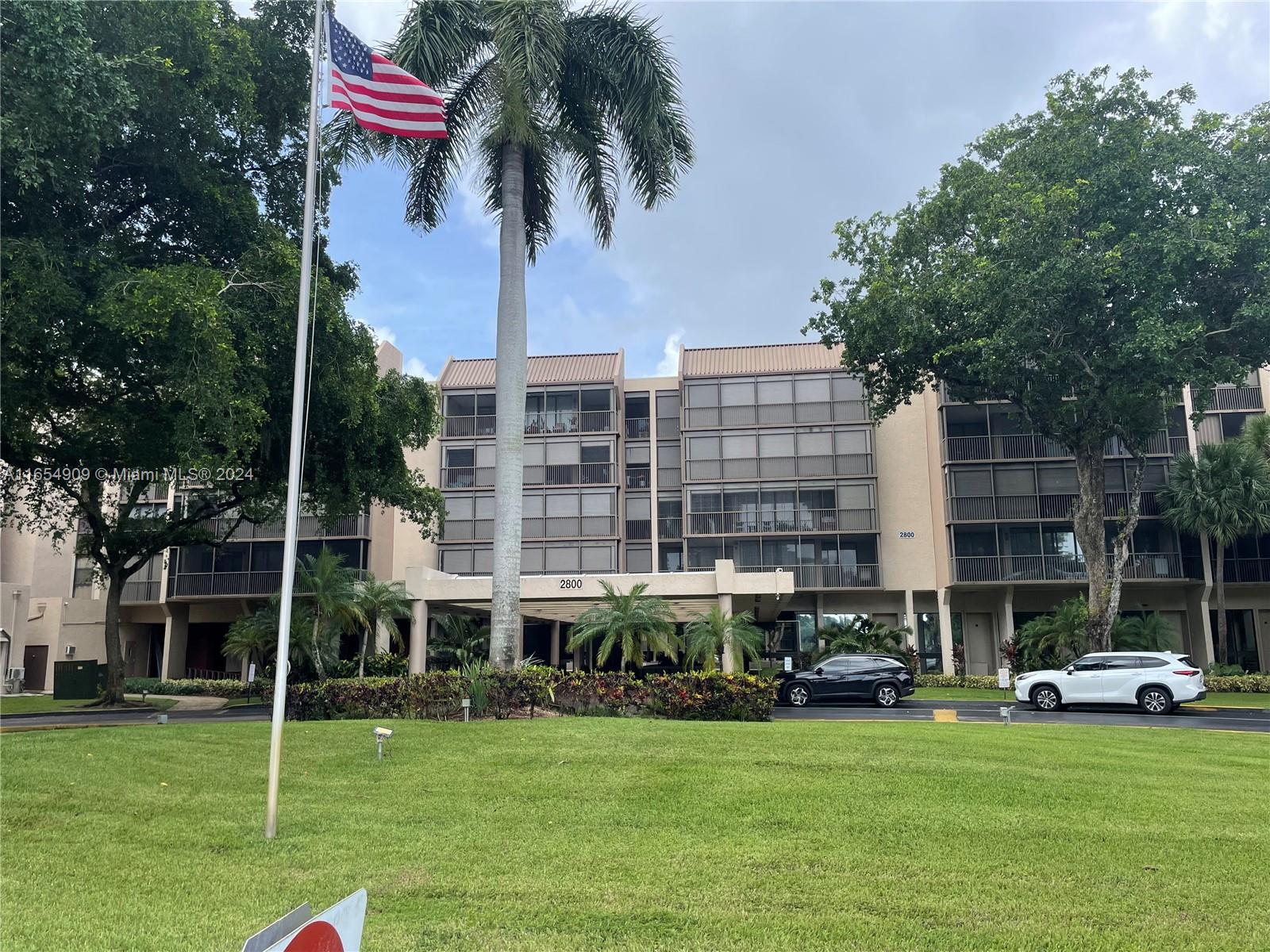 a view of a building with a yard