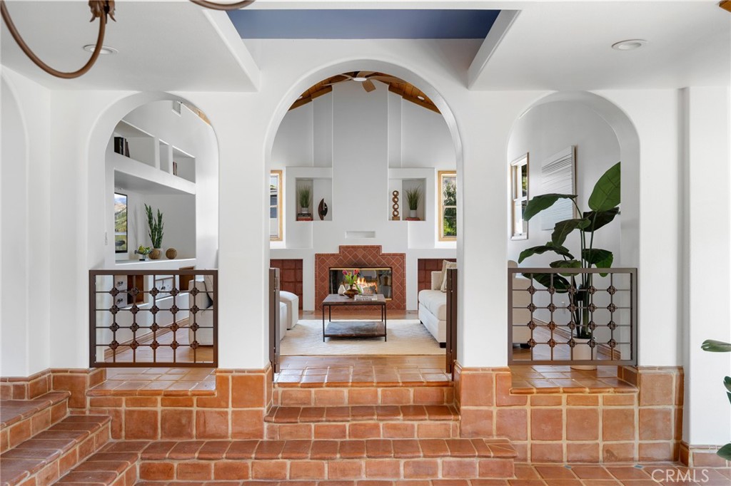 a view of a living room and entryway