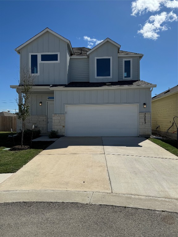 a front view of a house with garage