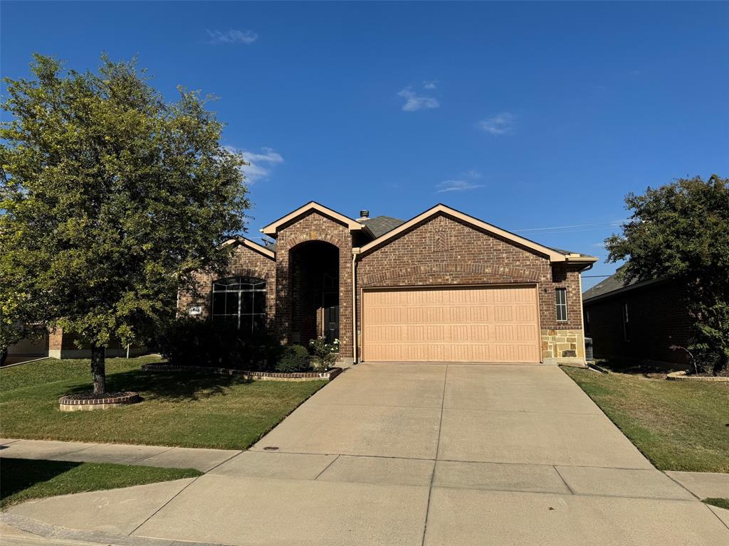 a front view of a house with yard