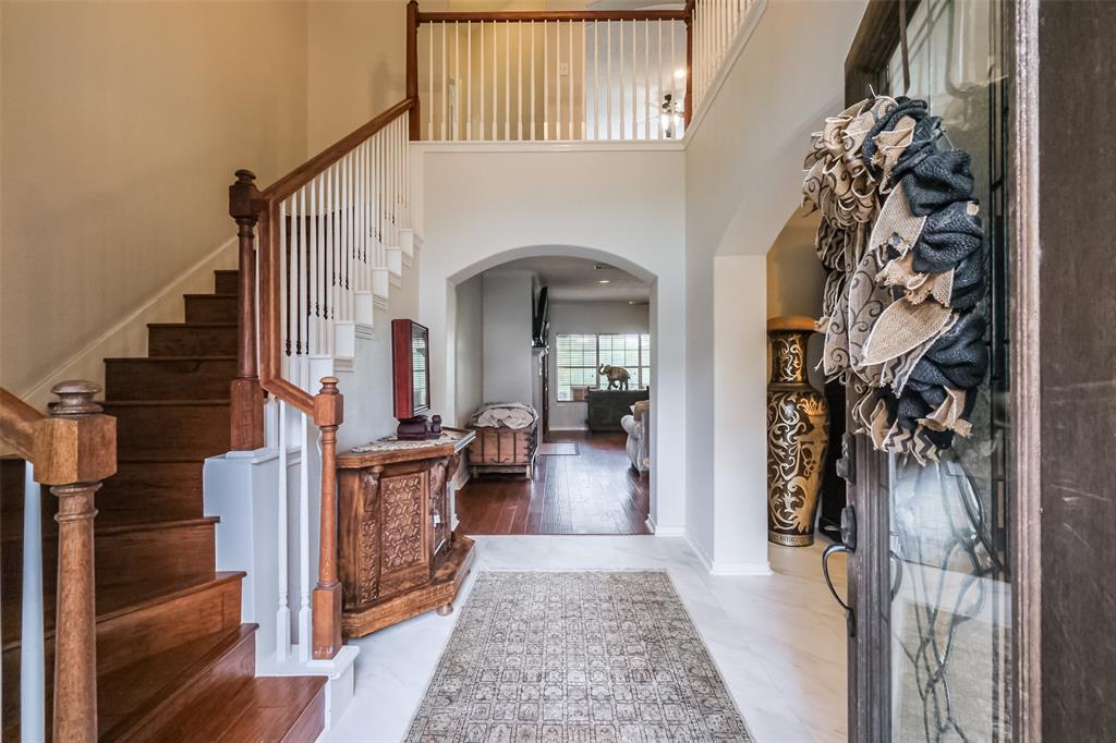 a view of a hallway view with staircase