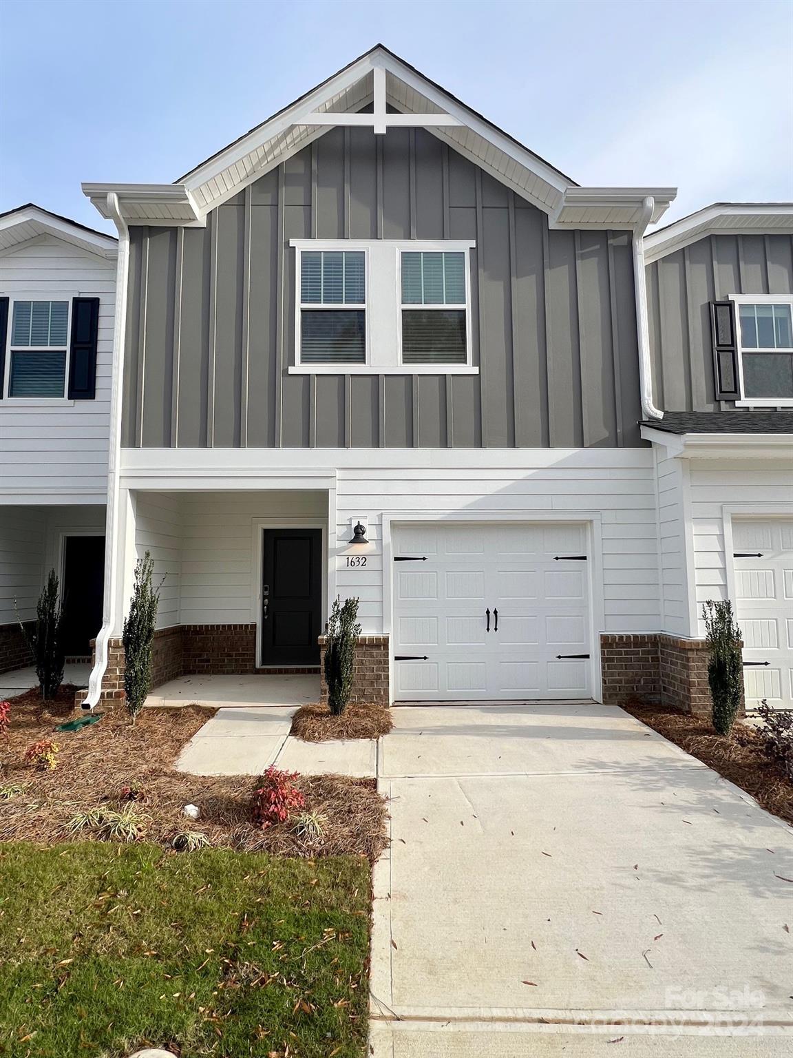 a front view of a house with yard