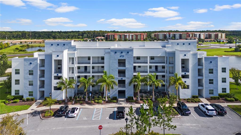 a front view of building with outdoor space and lake view