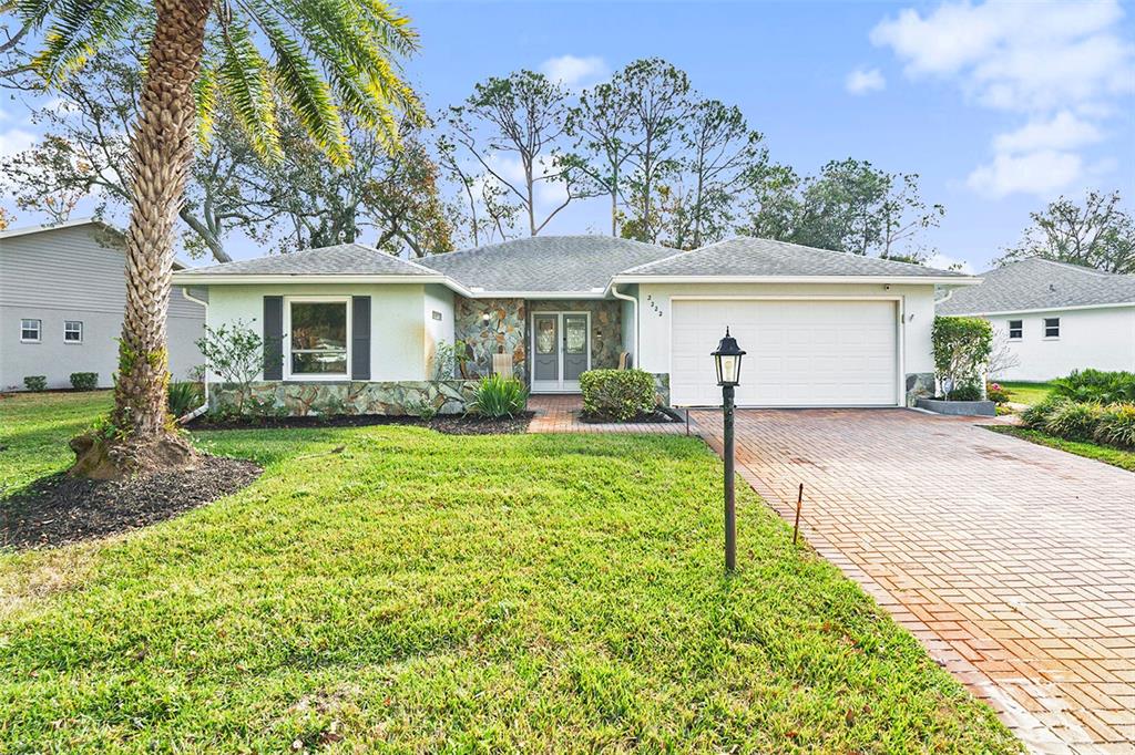 front view of a house with a yard