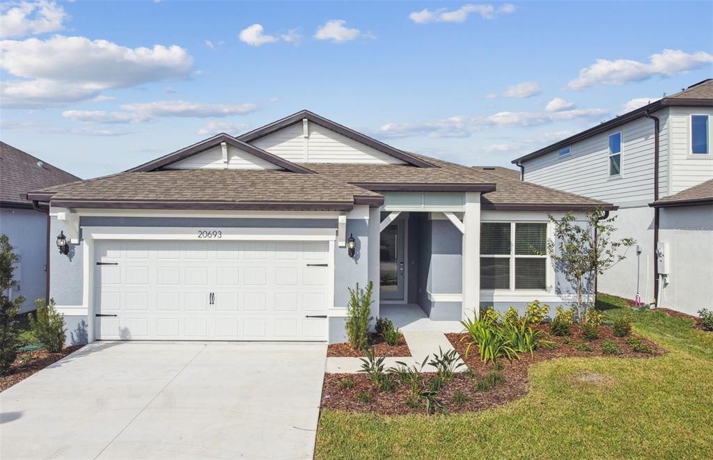 front view of a house with a yard