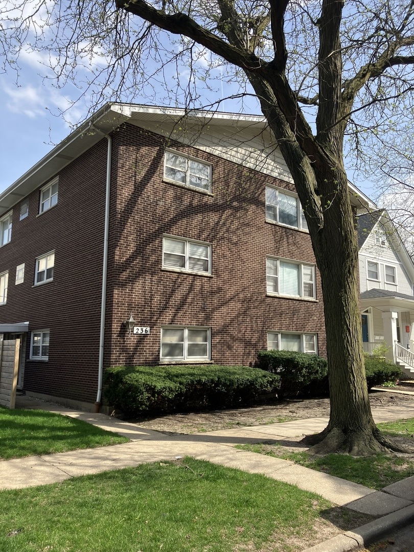 a view of house with yard