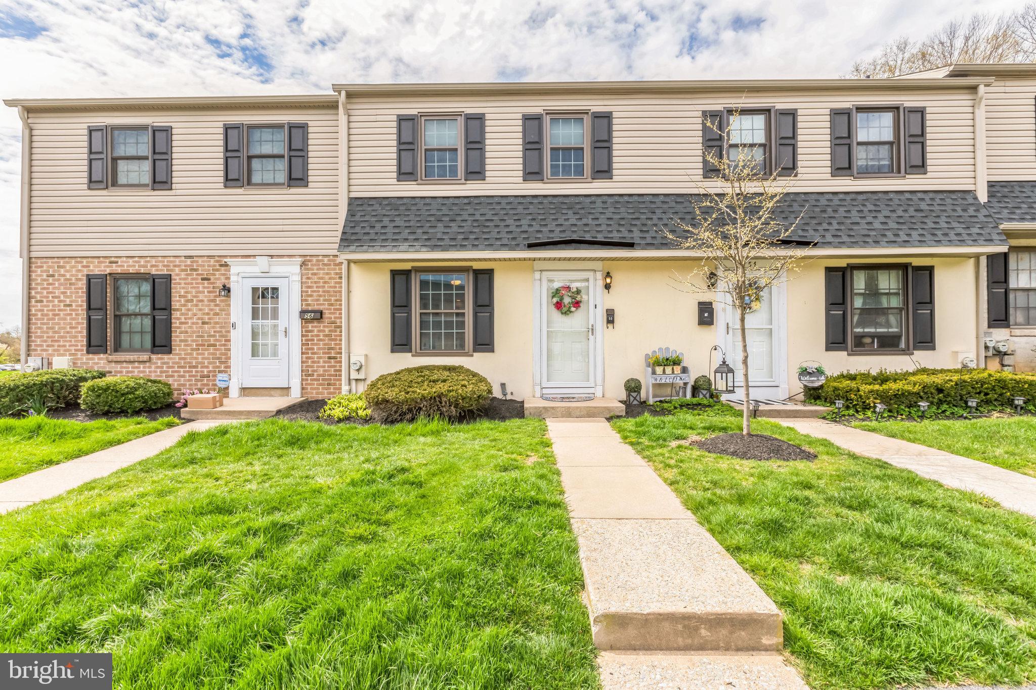 front view of a house with a yard