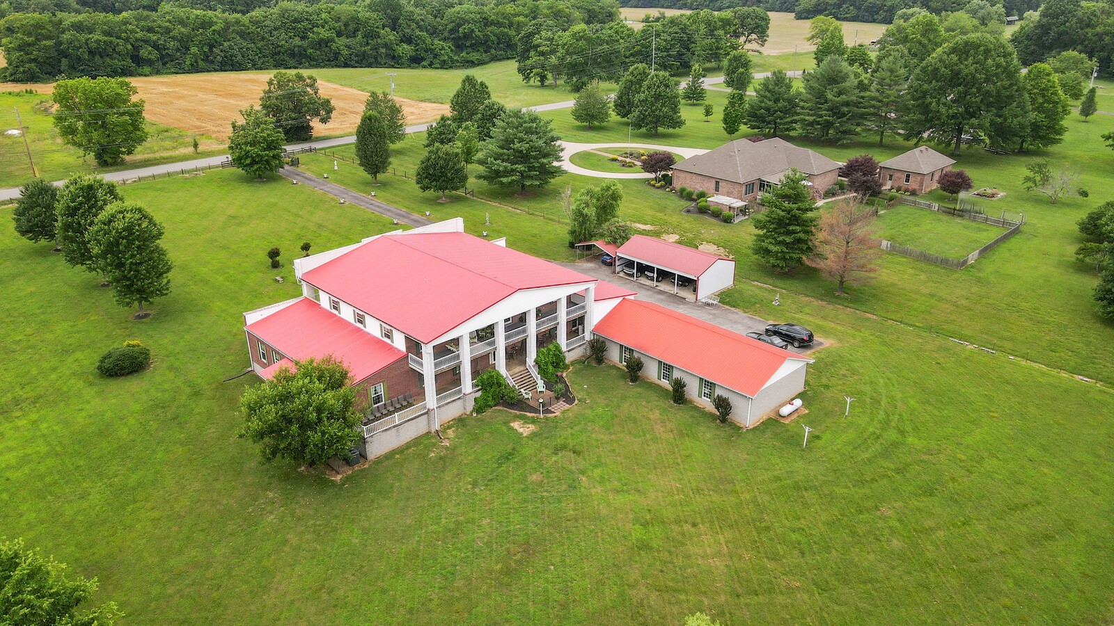 an aerial view of residential house with outdoor space and swimming pool