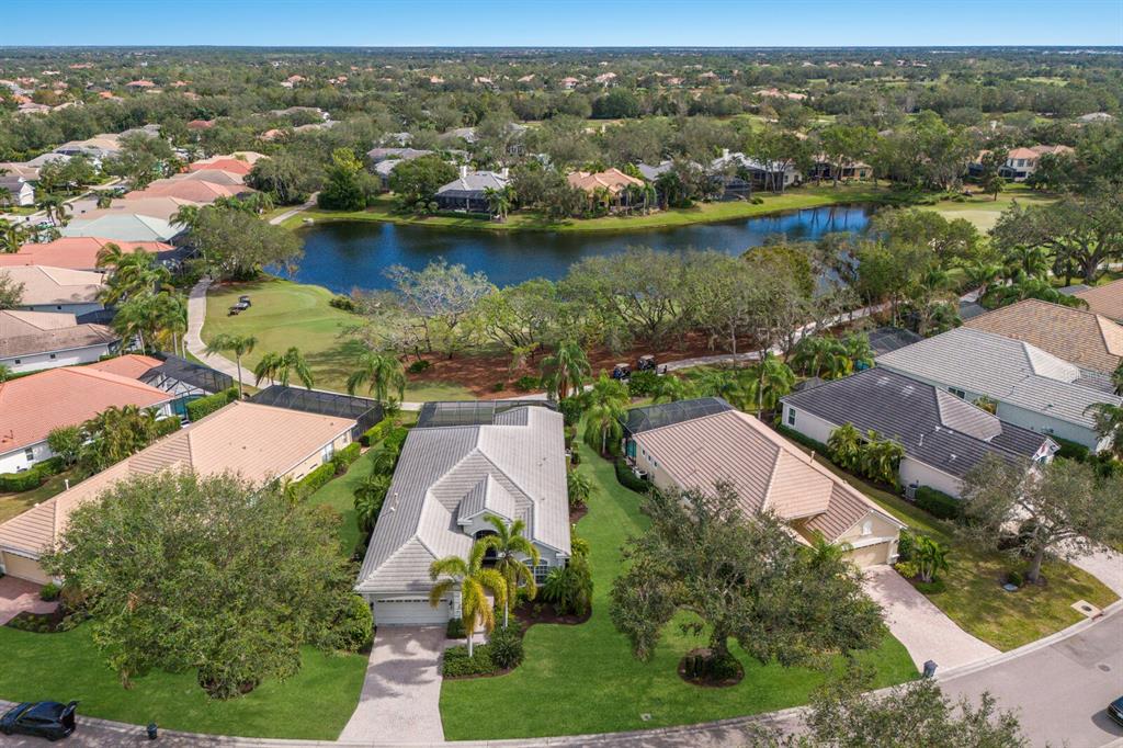 an aerial view of a house with a lake view