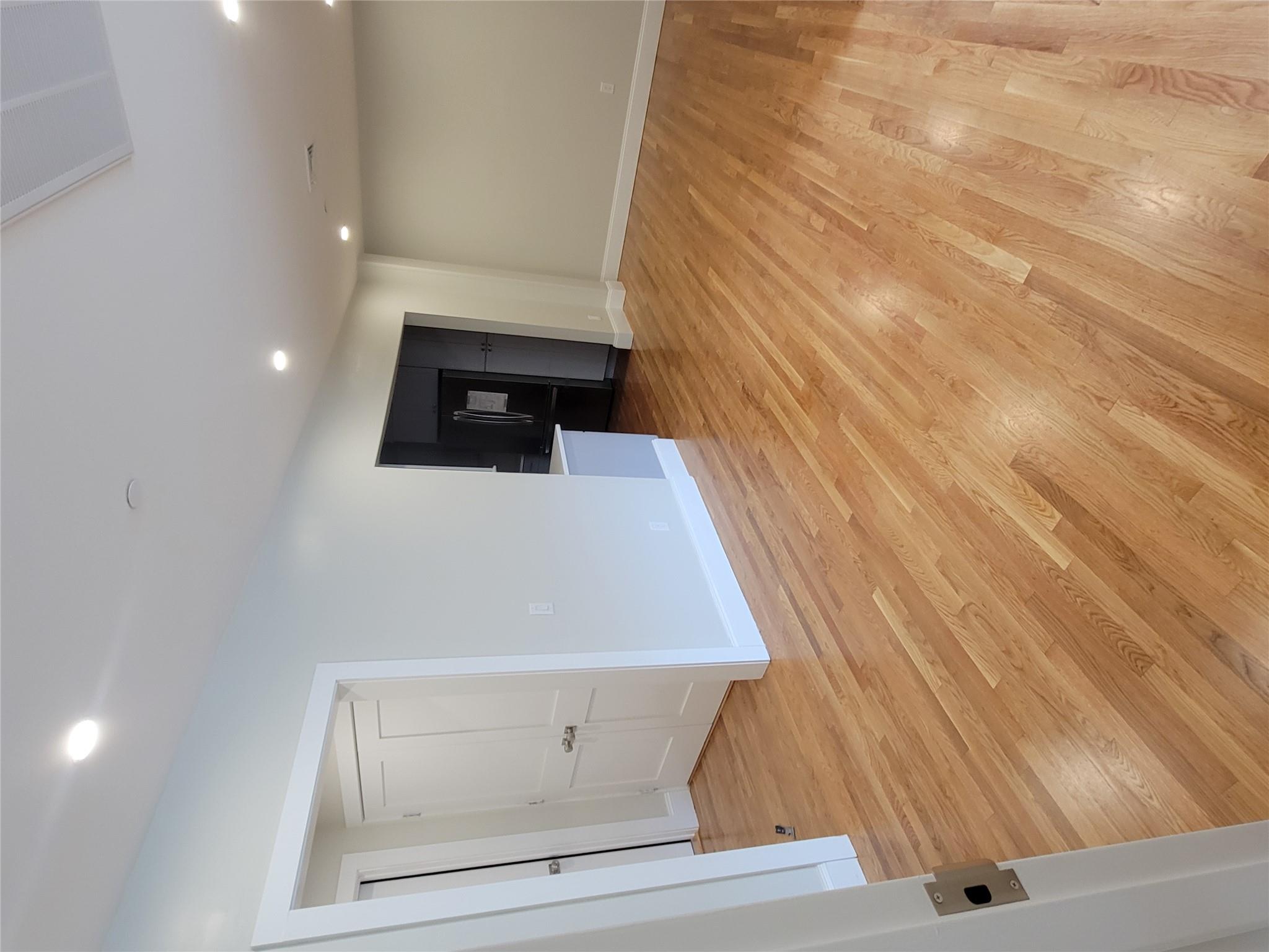 Unfurnished living room featuring light hardwood / wood-style flooring