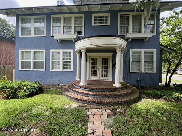 a front view of a house with garden