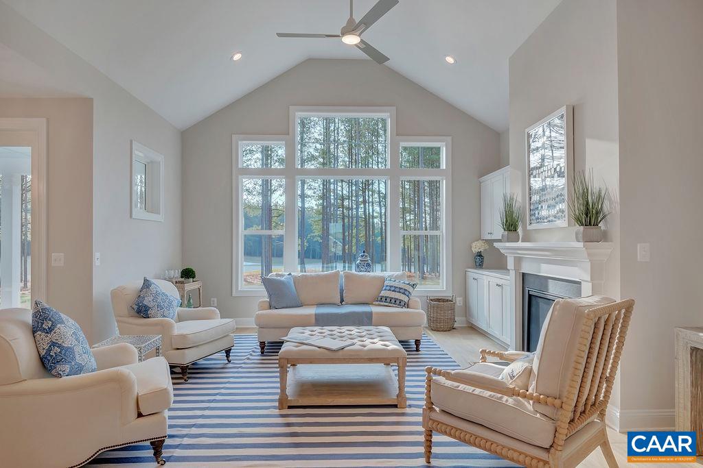 a living room with furniture large window and couch