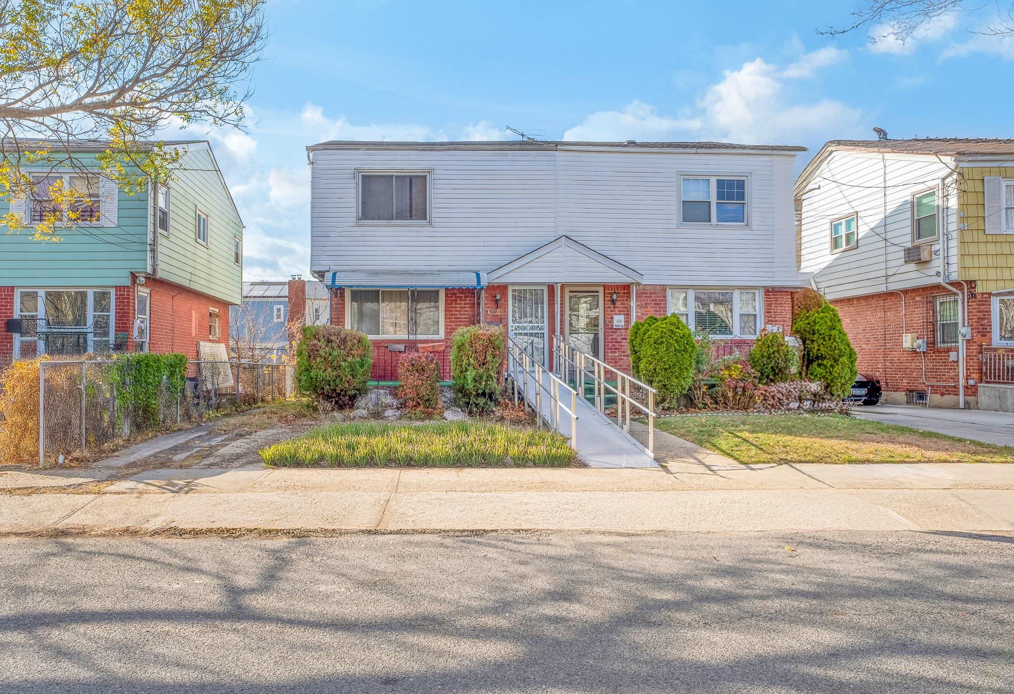 View of front of property featuring cooling unit