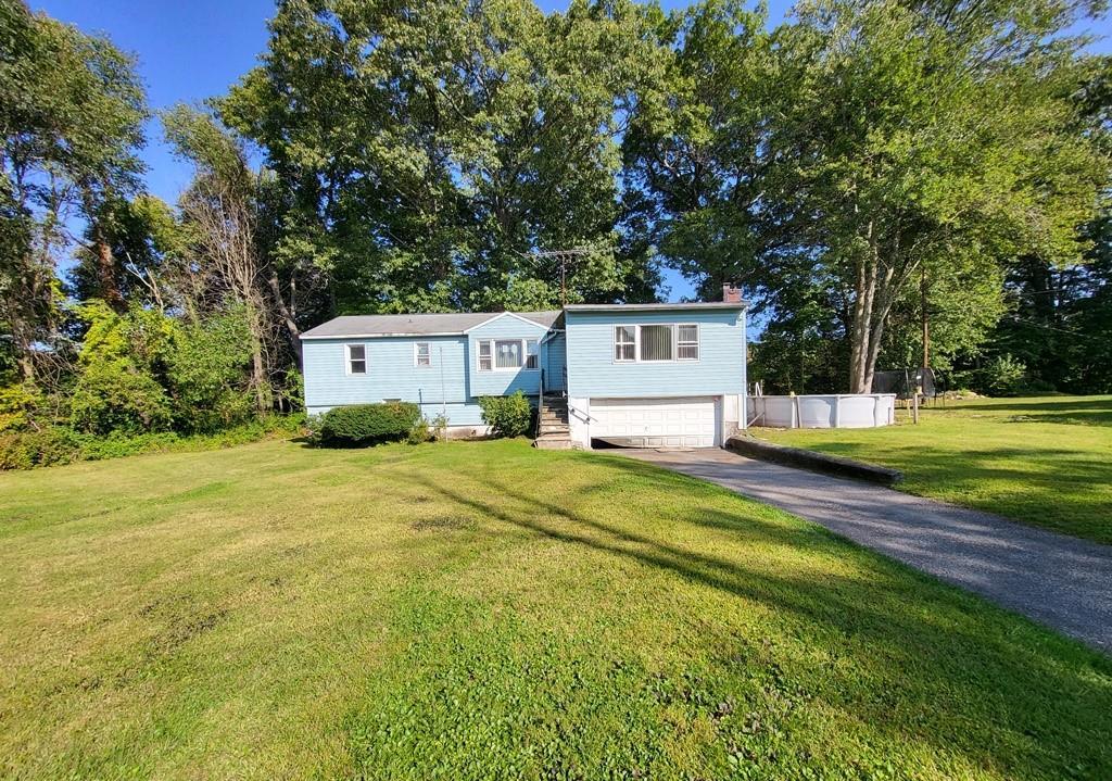 a view of a house with a big yard