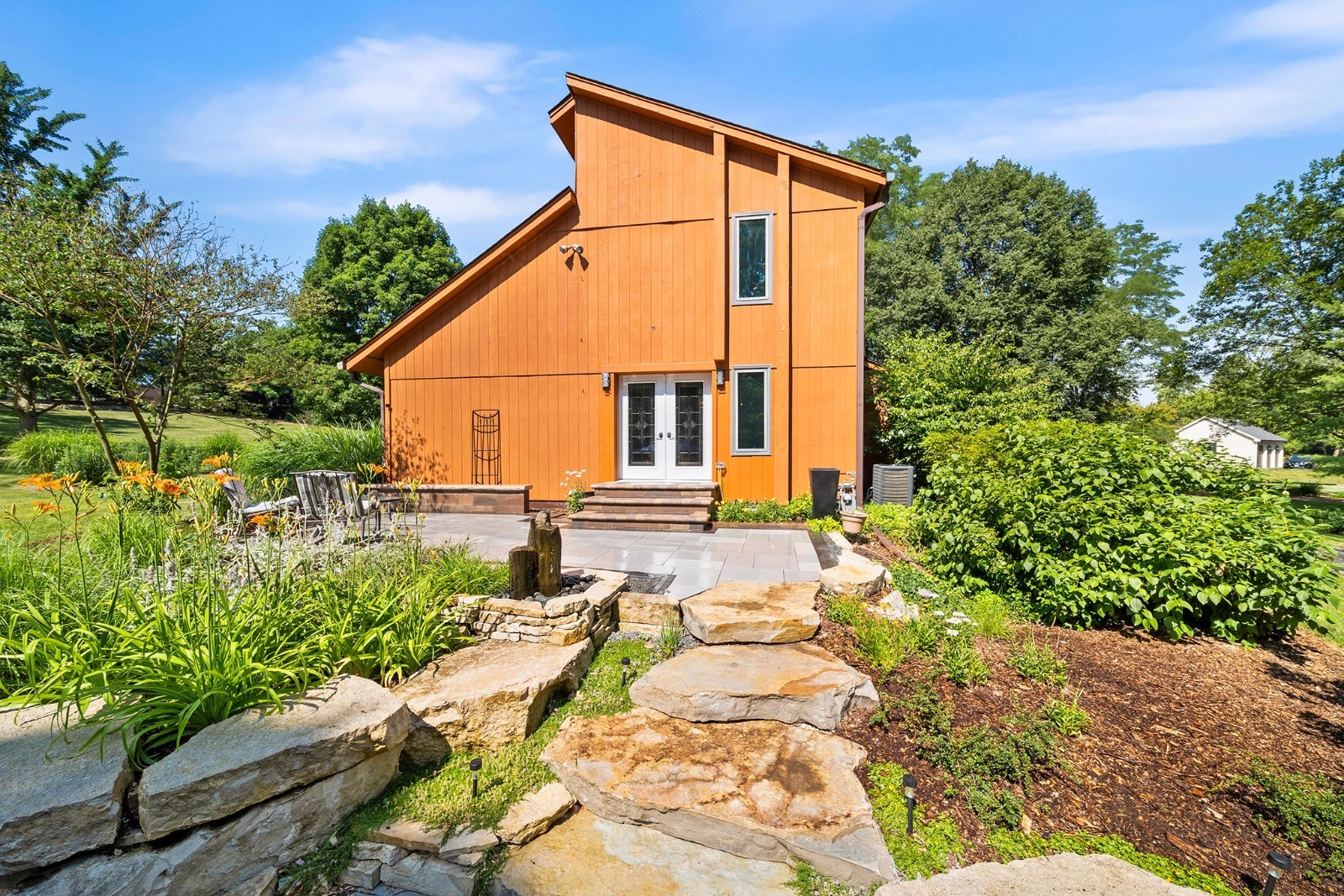 a backyard of a house with lots of green space