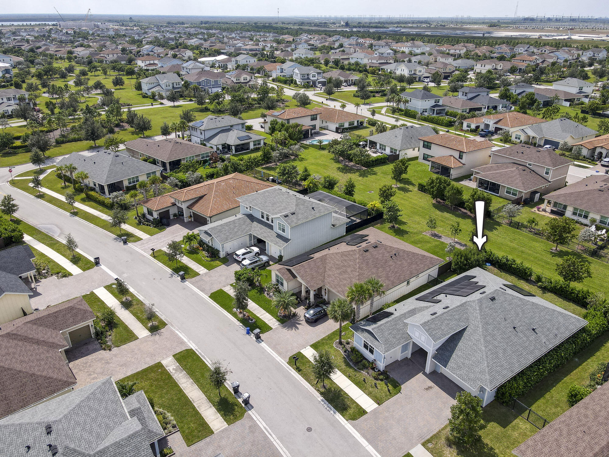 an aerial view of residential houses with outdoor space