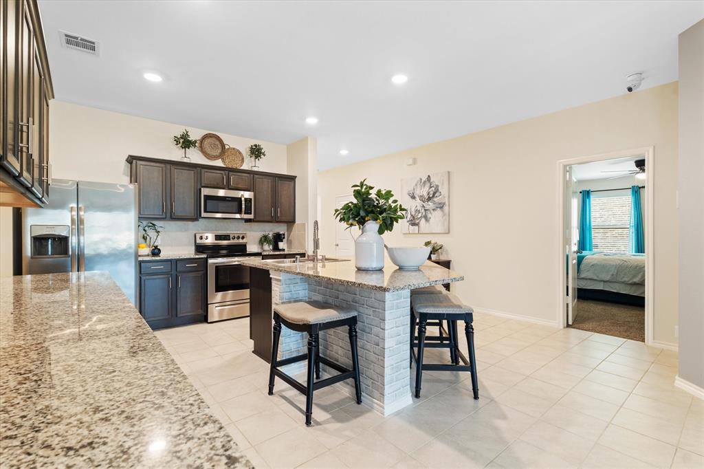 a kitchen with a sink cabinets and window