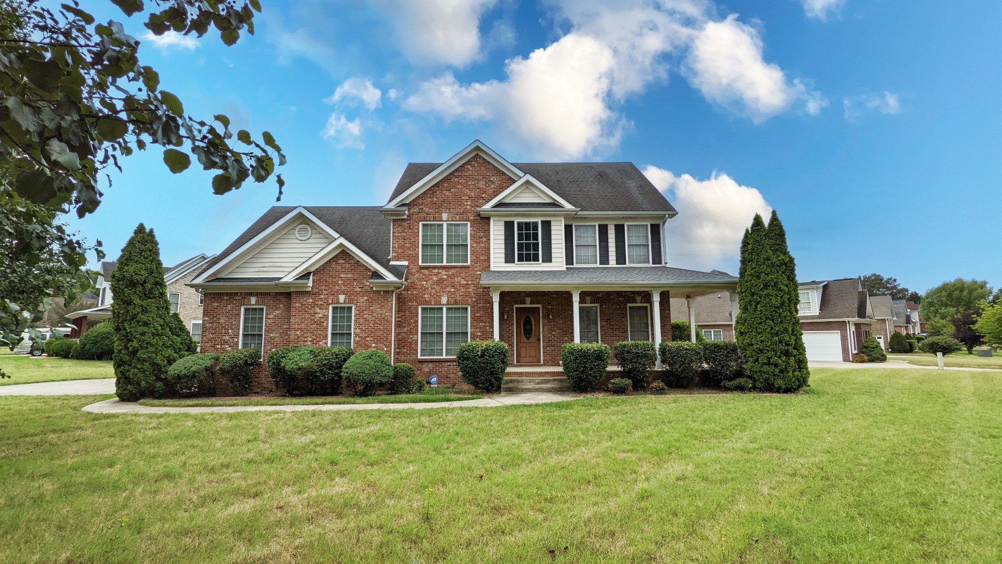 a front view of a house with garden