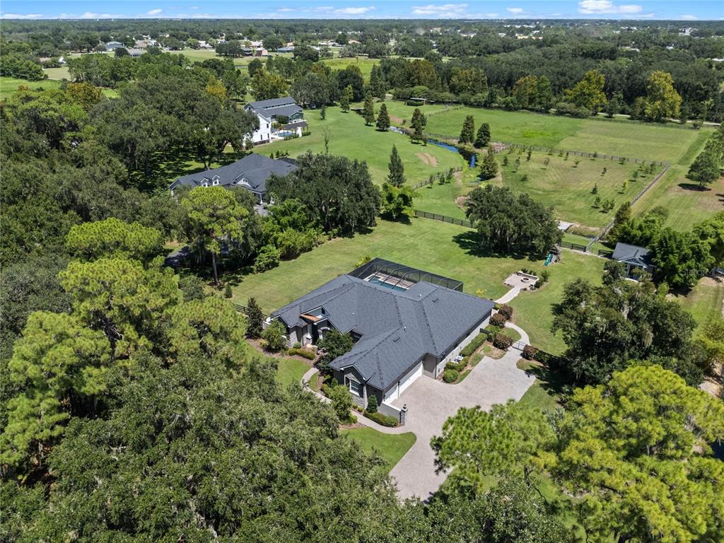 an aerial view of a house with mountain view