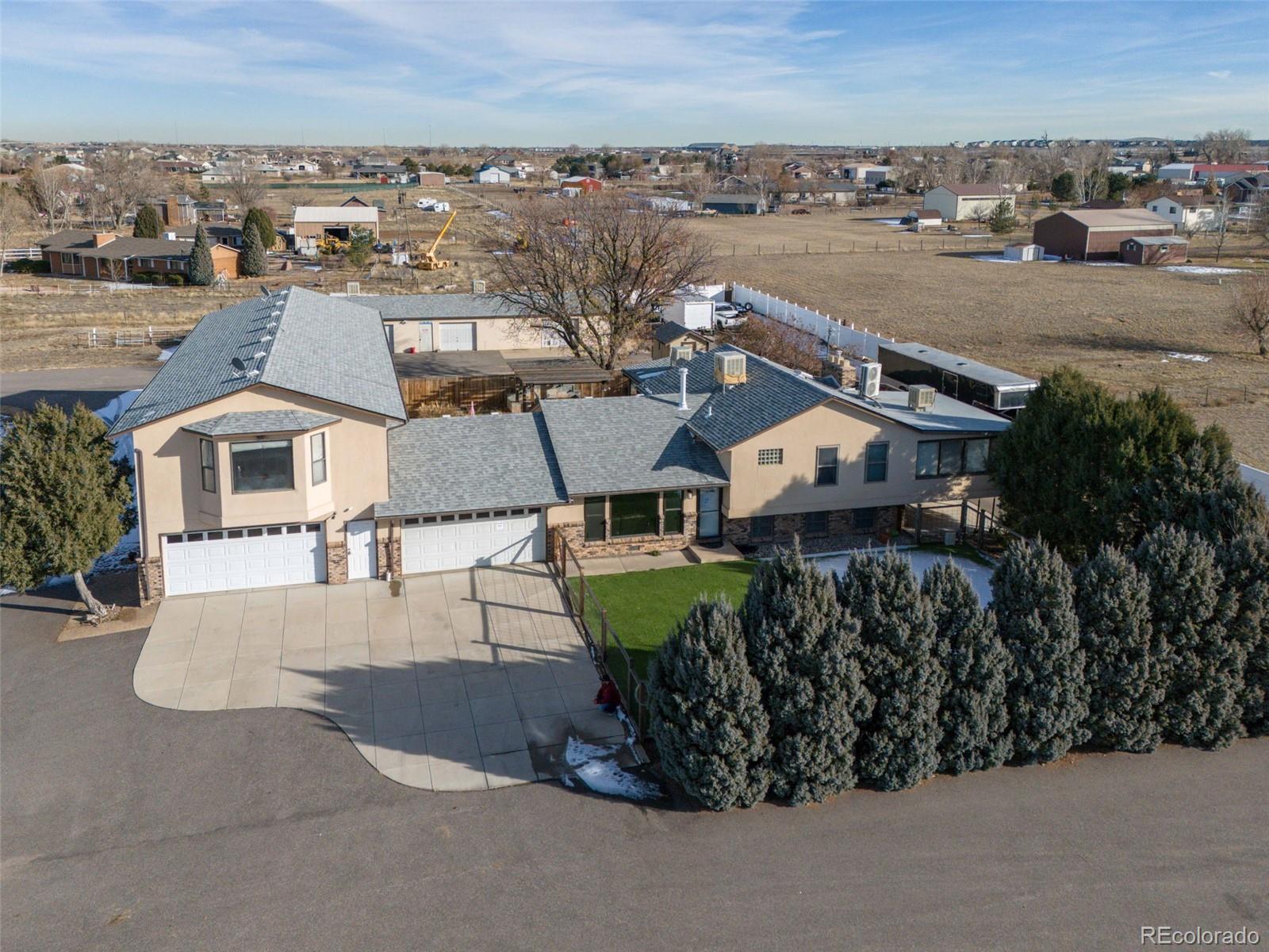 an aerial view of a house with a garden