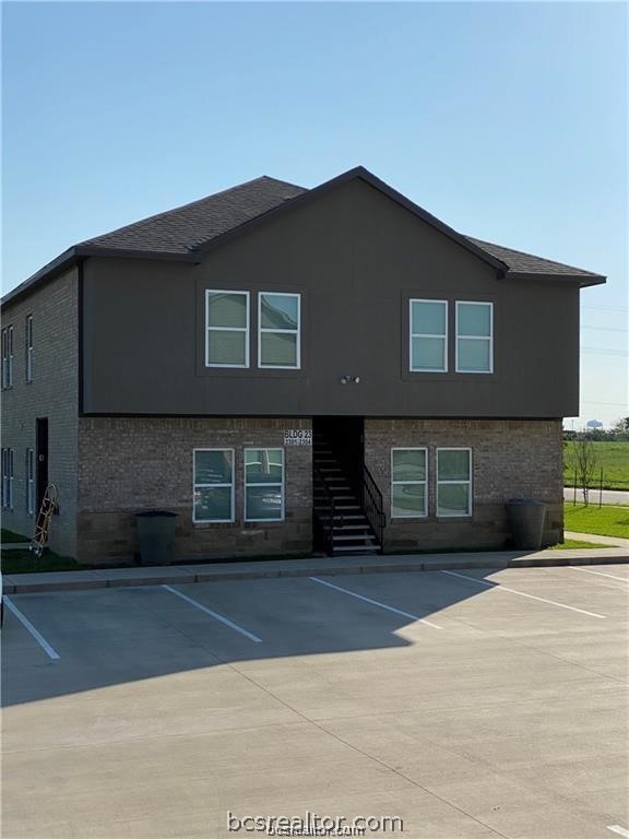 a front view of a house with a garage