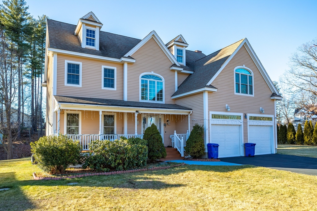 a view of house with yard outdoor seating and swimming pool