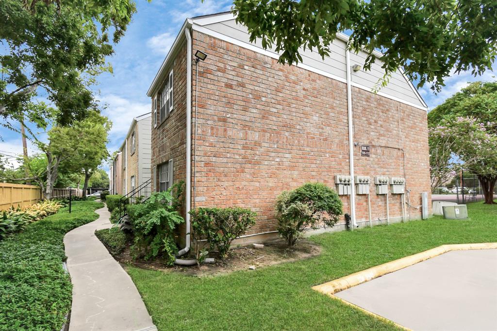 a view of a building with a yard