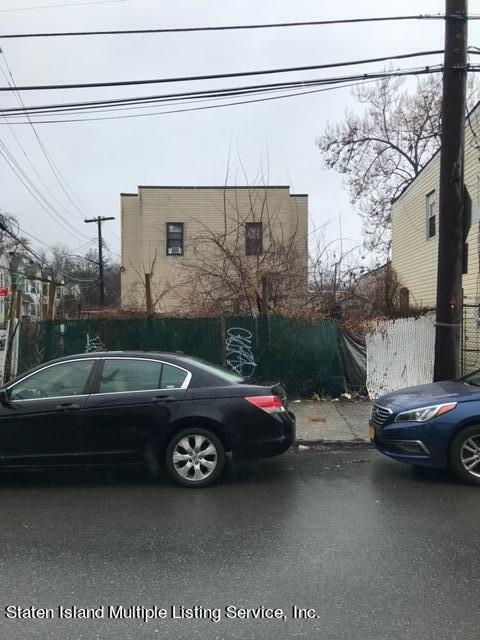 a view of a cars parked in front of a house