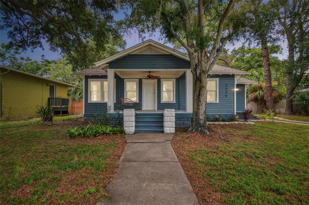 a front view of a house with garden