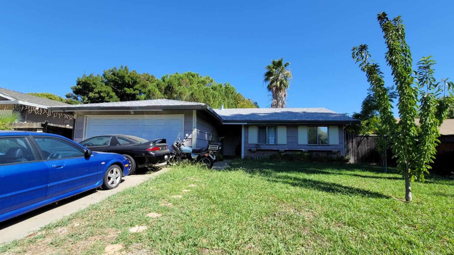 a view of a house with a back yard