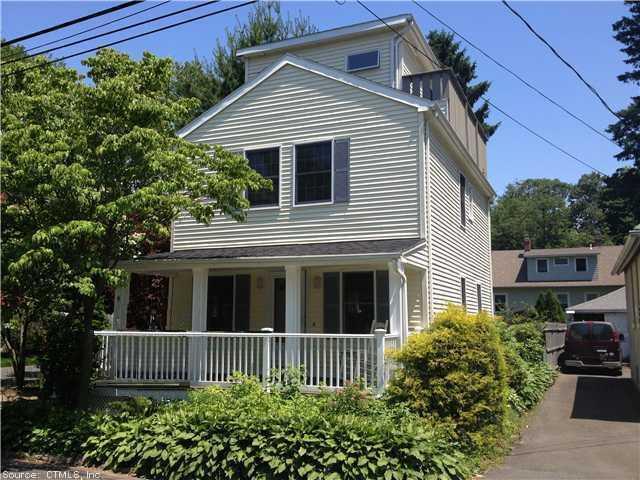 a view of a house with a small garden