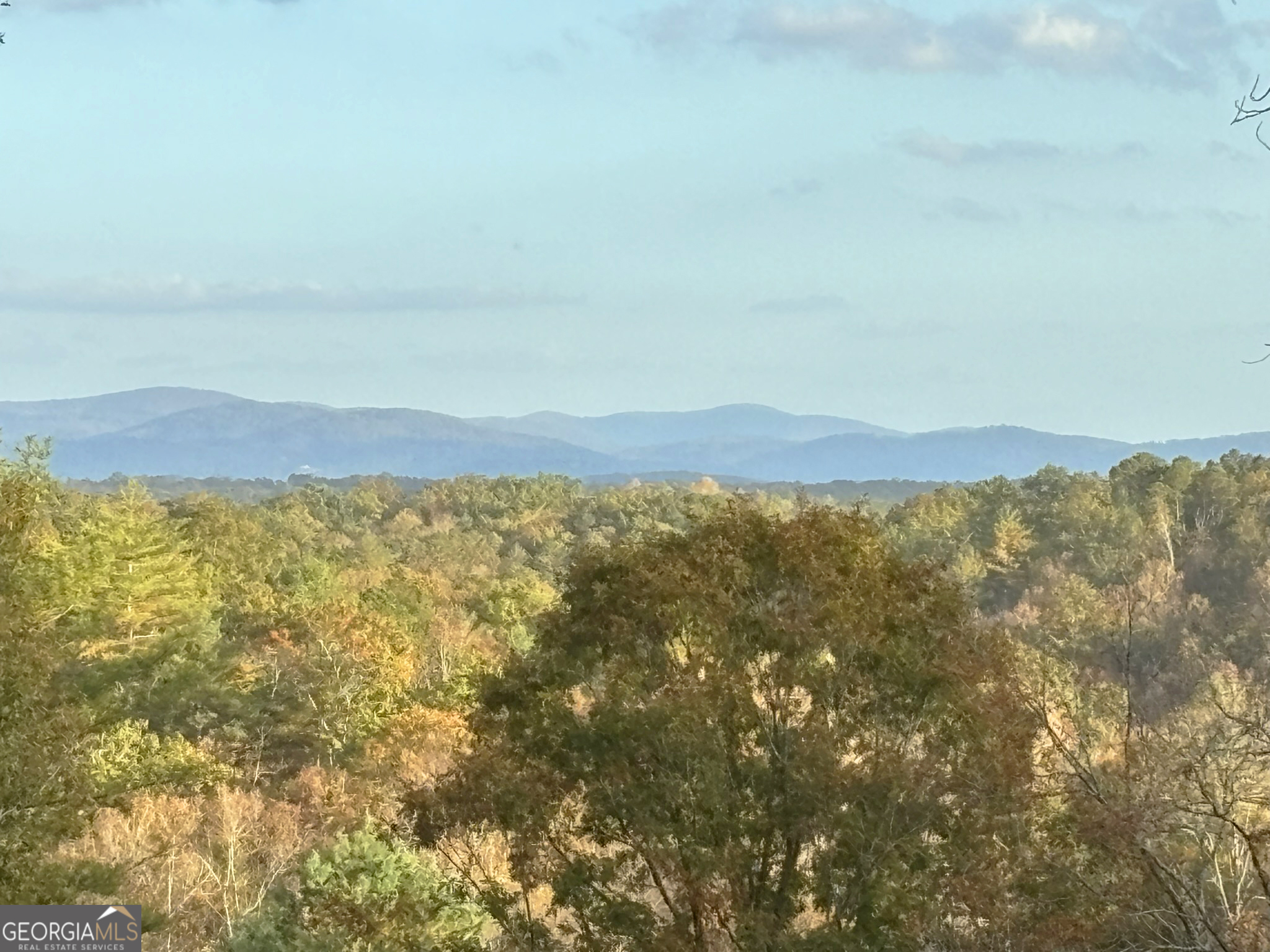 a view of a large body of water and mountain