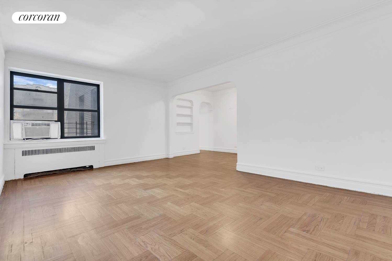 a view of an empty room with a window