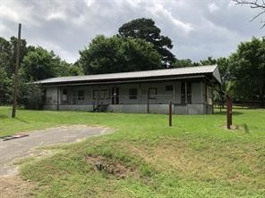 a house with trees in the background