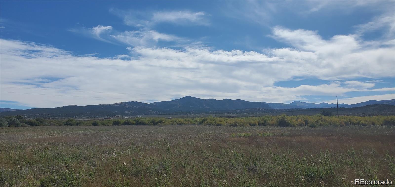 a view of a town with mountains in the background