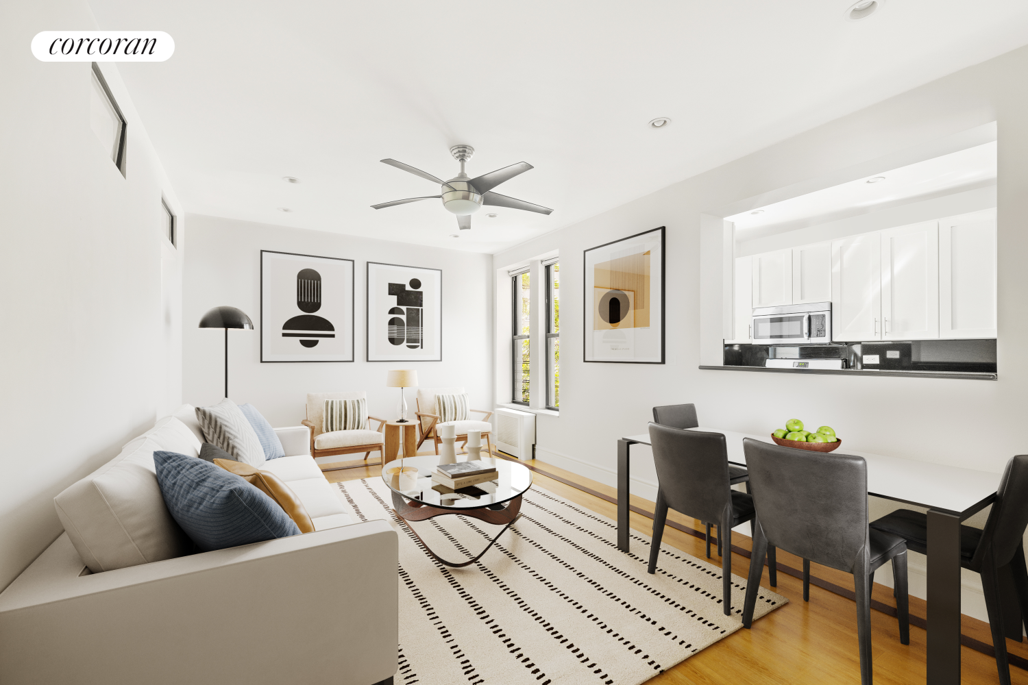 a living room with furniture and kitchen view