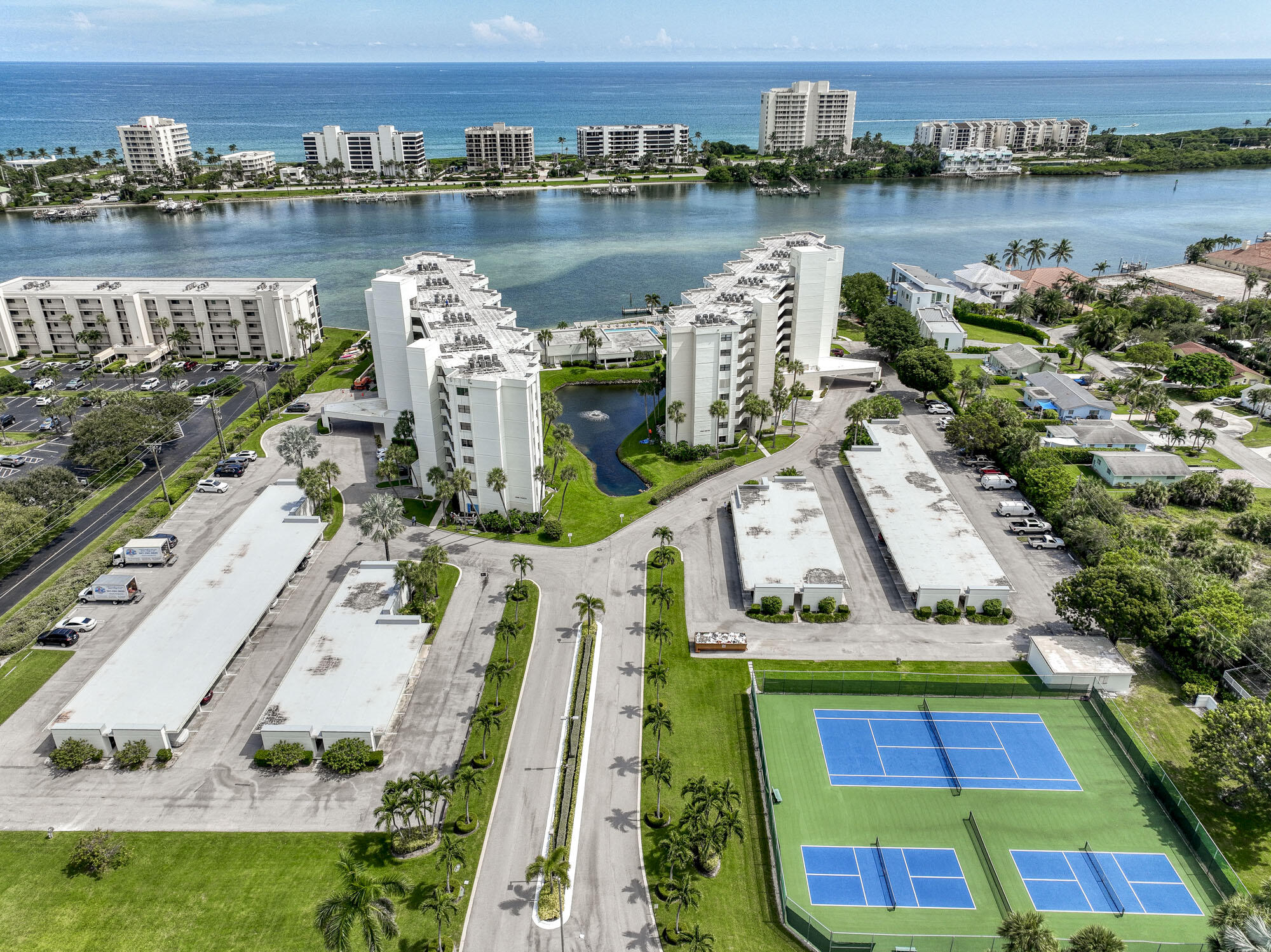 an aerial view of a house with outdoor space and lake view