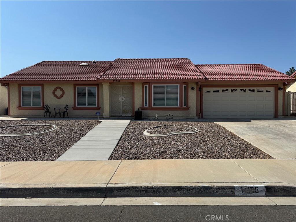 a front view of a house with yard