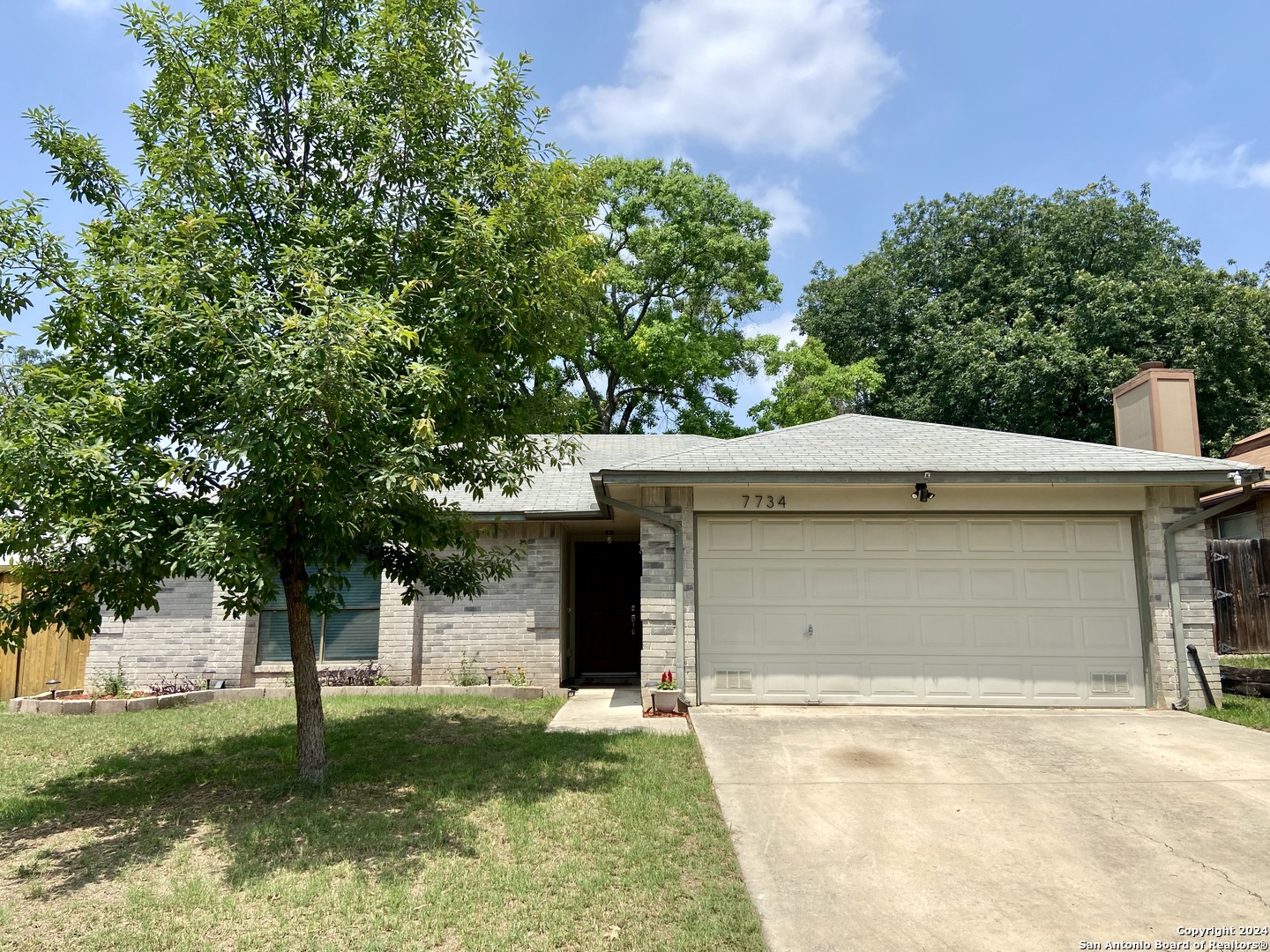 front view of a house with a yard