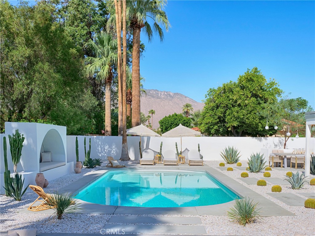 a view of a swimming pool with a patio