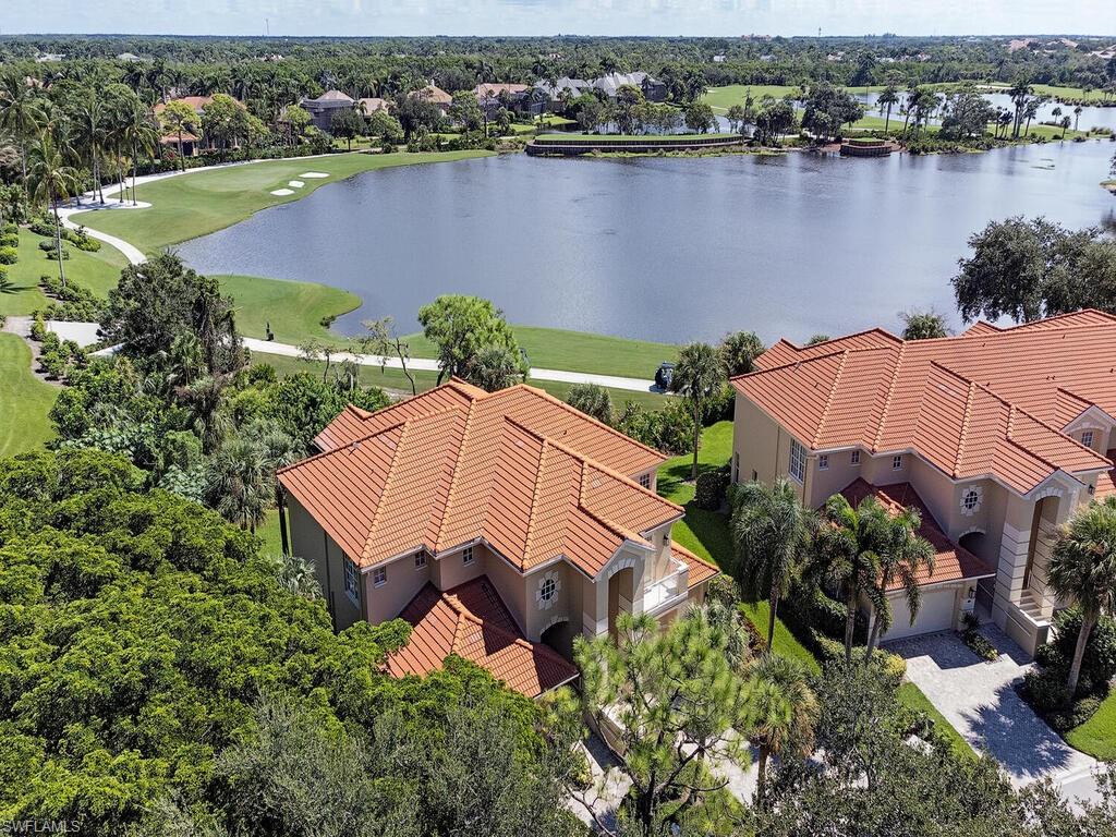 an aerial view of a house with a lake view