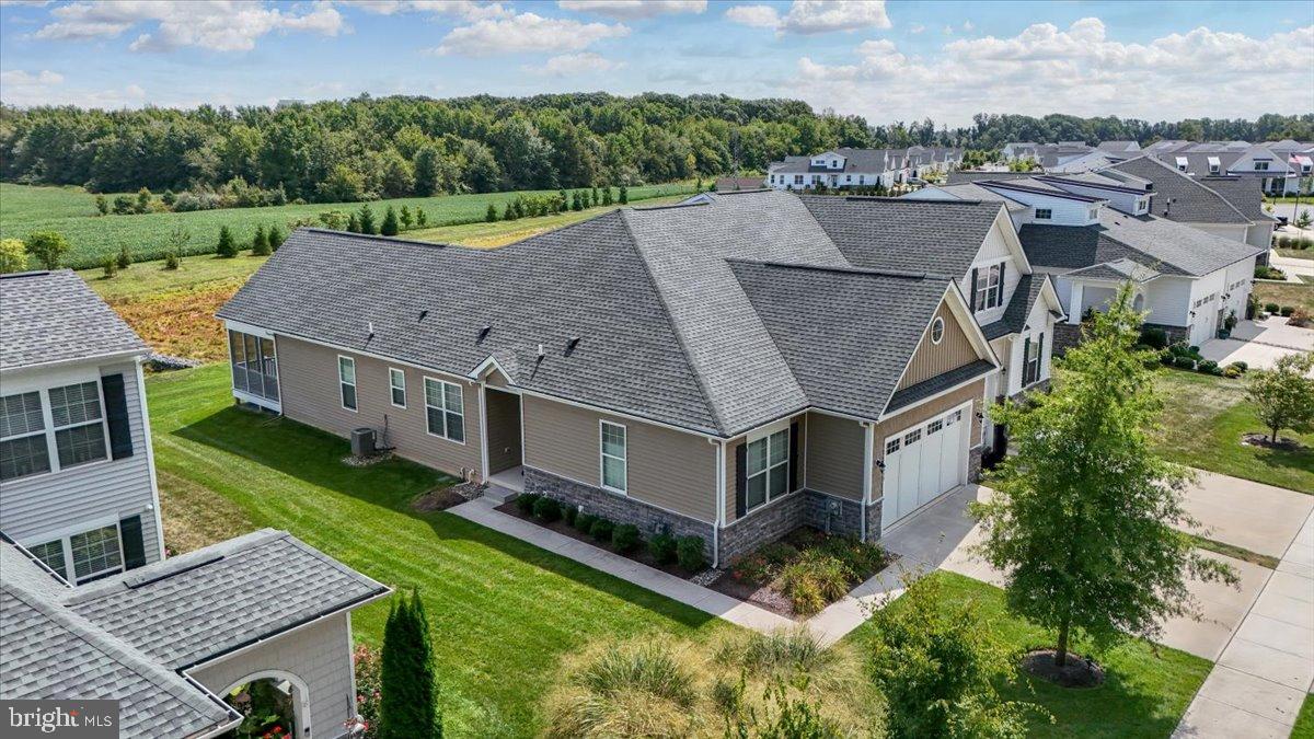 an aerial view of a house with a garden and plants