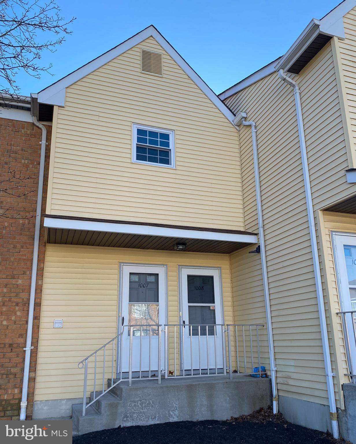 a front view of a house with yard