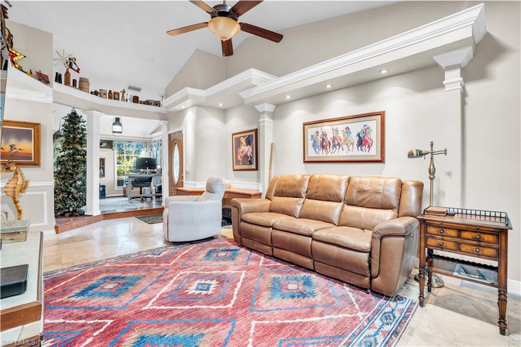 a living room with furniture and a rug