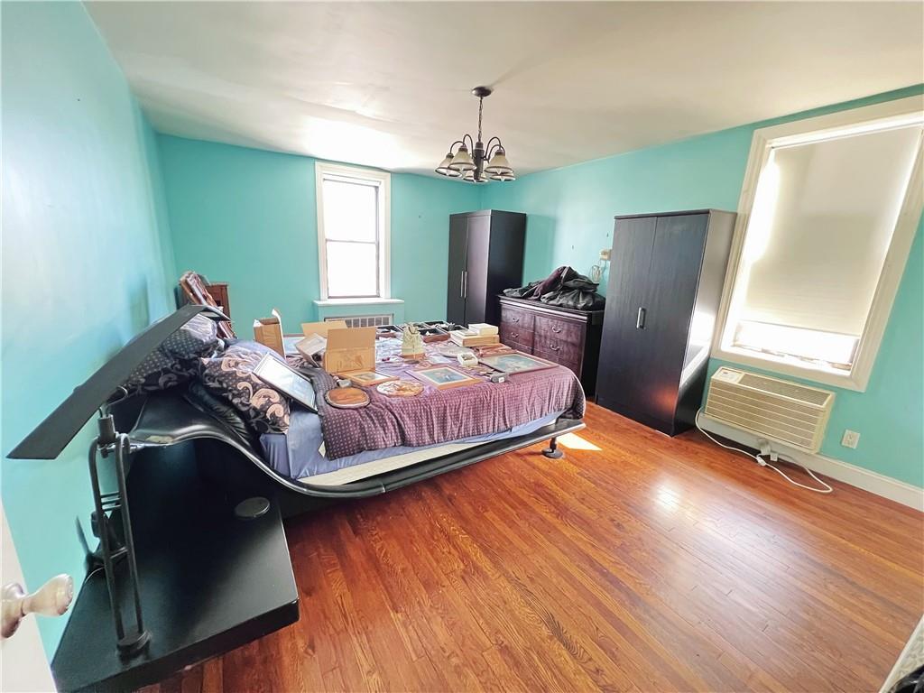 a bedroom with bed and window