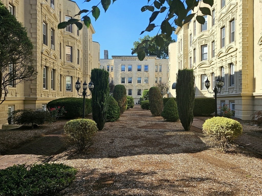 a view of a street with a building in the background