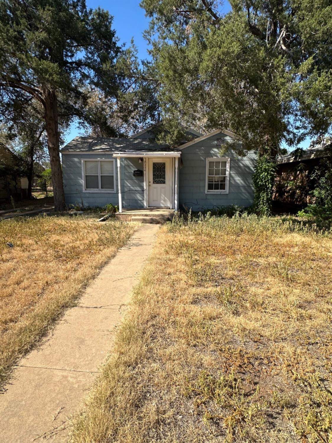 a house with trees in front of it