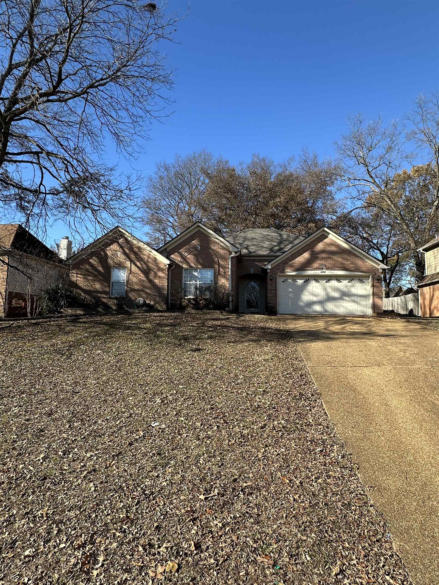 a view of house with a yard