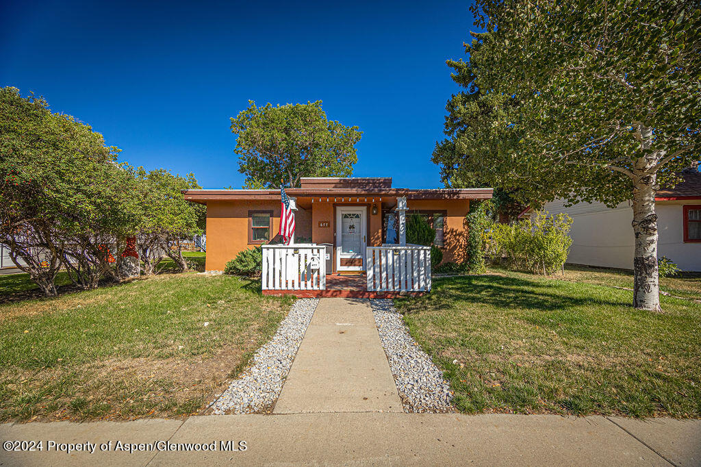 front view of a house with a yard