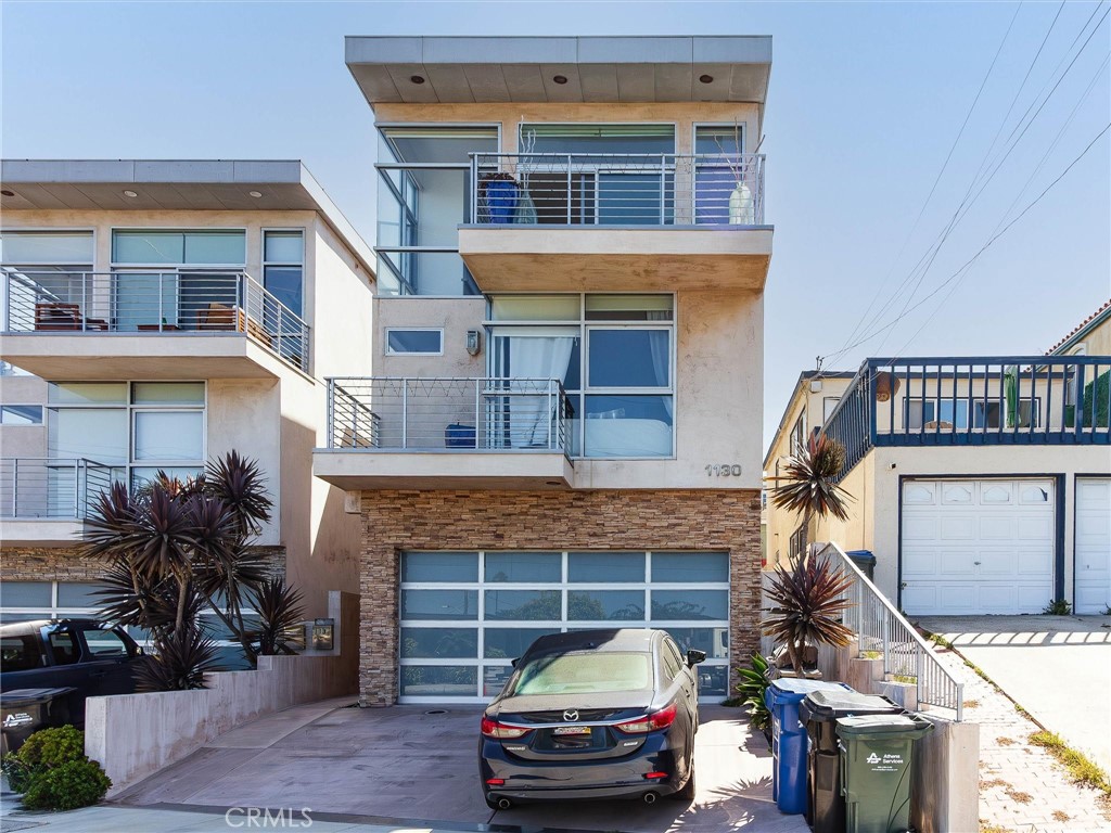 a front view of a house with a garage